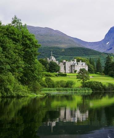 Exterior view of Inverlochy Castle Hotel from across the water