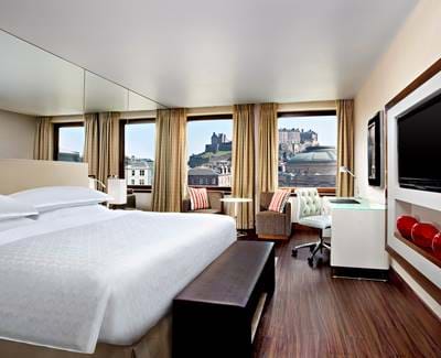 Bedroom at the Sheraton Grand Hotel & Spa with a view of Edinburgh Castle.